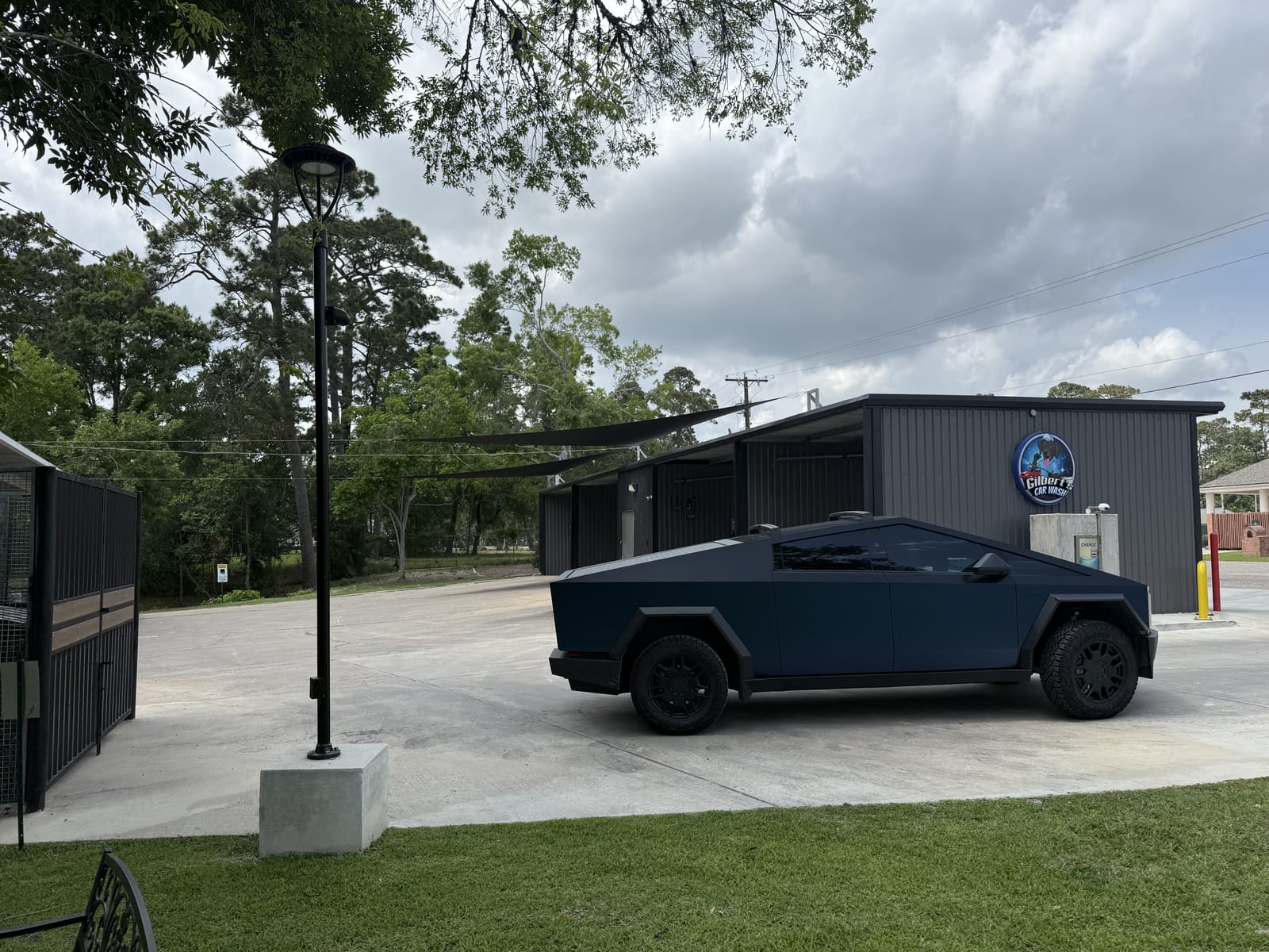 Covered self-serve wash bays at Gilbert's Car Wash Dickinson.