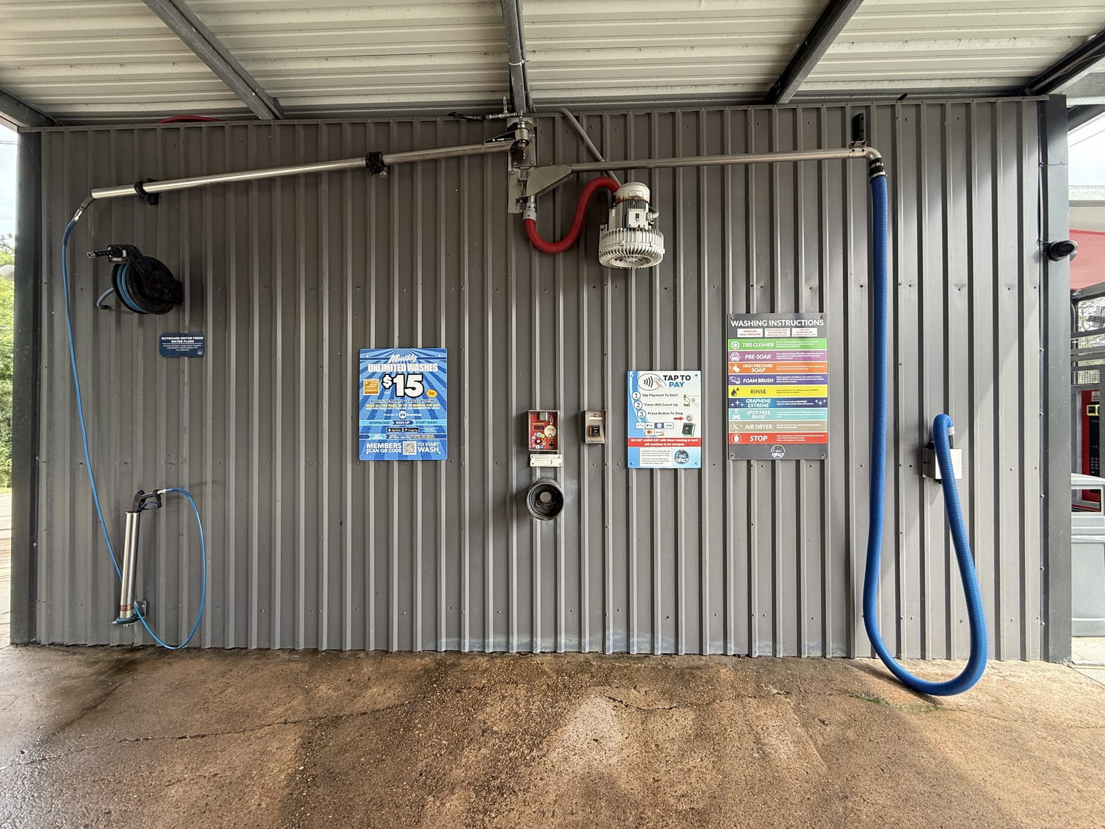 A self-serve wash bay at Gilbert's Car Wash Dickinson.